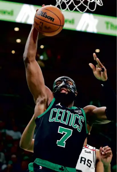  ?? JIM DAVIS/GLOBE STAFF ?? With Jaylen Brown putting up 41 points and pulling down 13 rebounds in a third straight blowout victory, the Celtics continued their upward trend as the regular season winds down.