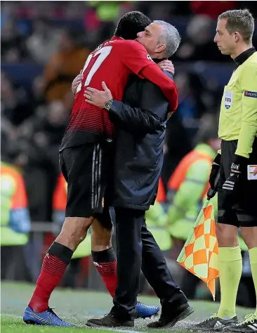  ?? GETTY IMAGES ?? Jose Mourinho hugs Marouane Fellaini after Manchester United’s Champions League win over Young Boys at Old Trafford yesterday.