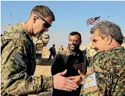  ?? PHOTO: AP ?? US Army Major General Jamie Jarrard, left, thanks Manbij Military Council commander Muhammed Abu Adeel during a visit to a small outpost near the town of Manbij, northern Syria, this week.