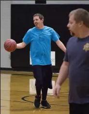  ?? Katie Roth / The Fort Morgan Times ?? A Falcons player smiles while dribbling the ball in the game Oct. 14 with the Sheriff's Office team.