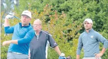  ??  ?? Twenty Valley's Kyle Stephenson, left, tees off at the Champion of Champions golf tournament Saturday at Rockway Vineyards. At right is Port Colborne's Matt Graham.