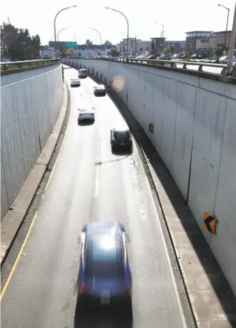  ?? Paul Chinn / The Chronicle ?? Cars emerge from the Webster Street Tube into Alameda. The City Council will vote Tuesday on a proposal to install license plate readers at entry and exit points of the island city.