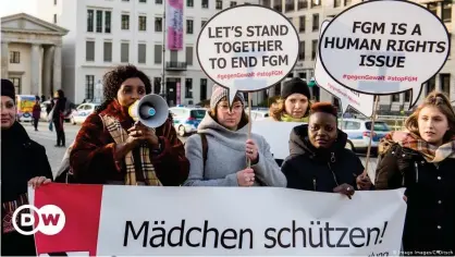  ??  ?? A 2019 protest by the Terre des Femme NGO in Berlin. The main German-language banner reads: 'Protect girls!"