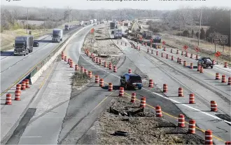  ?? BILL LACKEY/STAFF ?? Interstate 70 eastbound traffic winds through the Clark County widening project. Experts expect about a third fewer Ohioans to travel this holiday season.