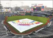  ?? Mitchell Layton / Getty Images ?? The tarp covers the field as Washington announces the cancellati­on of Tuesday’s game against the Yankees at Nationals Park on Wednesday in Washington, D.C.