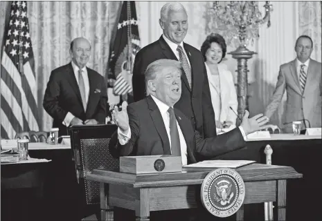  ?? ANDREW HARRER/BLOOMBERG ?? President Donald Trump speaks before signing the Space Policy Directive next to U.S. Vice President Mike Pence, during a National Space Council meeting in the East Room of the White House in Washington on Monday.