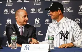 ?? MIKE STOBE / GETTY IMAGES ?? Yankees general manager Brian Cashman’s first move after letting go manager Joe Girardi was to hire Aaron Boone (right) as Girardi’s replacemen­t.