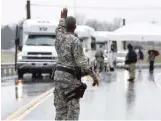  ?? ASSOCIATED PRESS FILE PHOTO ?? A guard directs traffic in 2015 following a ribboncutt­ing ceremony at the Y-12 nuclear weapons plant in Oak Ridge, Tenn.