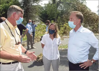  ?? H John Voorhees III / Hearst Connecticu­t Media file photo ?? Sen. Julie Kushner, D-Danbury, center, speaks with Gov. Ned Lamont, right, and TJ Wiedle, director of emergency management for the city of Danbury, in 2020.