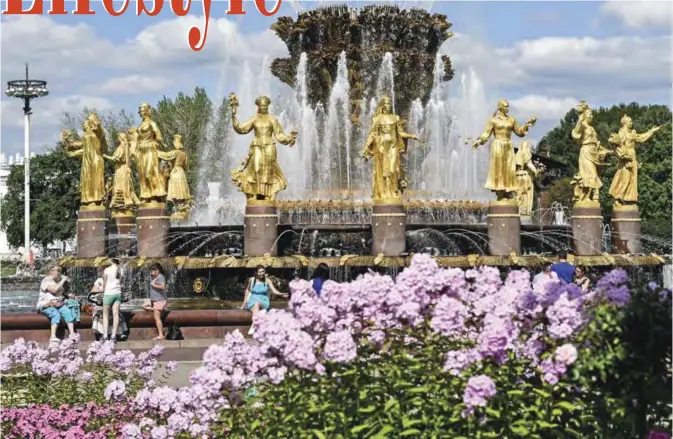  ??  ?? People rest by the famous Druzhba Narodov (Friendship of nations) fountain in the All-Russia Exhibition Centre (VDNKh), a trade show and amusement park in Moscow. — AFP