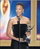  ?? PHIL MCCARTEN/INVISION ?? Samira Wiley accepts the Emmy for outstandin­g guest actress in a drama series on Saturday in Los Angeles.