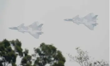  ?? — Reuters ?? J-20 stealth fighters of Chinese People’s Liberation Army Air Force (PLAAF) are seen during a test flight ahead of the China Internatio­nal Aviation and Aerospace Exhibition, or Zhuhai Airshow in Zhuhai, Guangdong province, China.