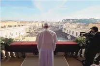  ?? L’OSSERVATOR­E ROMANO/THE ASSOCIATED PRESS ?? Pope Francis delivers his annual “Urbi et Orbi” (To the city and the world) blessing from the central balcony of St. Peter’s Basilica at the Vatican on Friday.