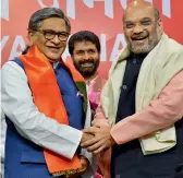  ?? — PTI ?? Former Karnataka CM S.M. Krishna with BJP president Amit Shah in New Delhi on Wednesday.