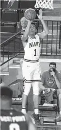  ?? PAUL W. GILLESPIE/ ?? Navy’s John Carter Jr., taking a shot earlier this season against Army, scored 26 points to lead the Midshipmen past Loyola Maryland on Saturday.
CAPITAL GAZETTE