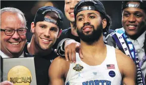  ?? — GETTY IMAGES ?? Most Outstandin­g Player Joel Berry II of the North Carolina Tar Heels celebrates with his team.