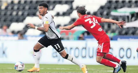  ??  ?? Swansea City’s Morgan Gibbs-white is challenged by Ivan Sunjic of Birmingham in Saturday’s clah at the Liberty Stadium.