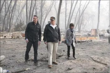  ?? Evan Vucci / Associated Press ?? President Donald Trump talks with California Gov.-elect Gavin Newsom during a visit to a neighborho­od destroyed by the wildfires Saturday in Paradise, Calif.