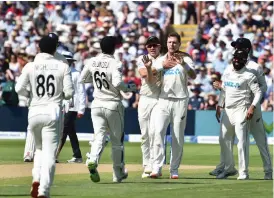  ?? — AP ?? New Zealand’s Matt Henry (third from right) celebrates with teammates the dismissal of Dom Sibley of England on the third day of their second Test on Saturday.