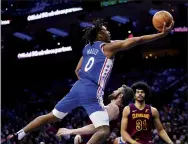  ?? AP photo ?? The 76ers’ Tyrese Maxey goes up for a shot against the Cavs’ Kevin Love on Friday.