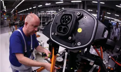  ?? Photograph: Ronny Hartmann/AFP/Getty Images ?? An electric car being assembled at the Volkswagen factory in Zwickau, Germany.