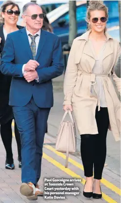  ??  ?? Paul Gascoigne arrives at Teesside Crown Court yesterday with his personal manager Katie Davies