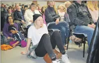  ?? SHARON MONTGOMERY-DUPE/CAPE BRETON POST ?? Ashley McKenzie of Sydney, formerly of New Waterford, listens during the town hall meeting organized by the A Town That Cares group at the New Waterford fire hall Tuesday night. More than 300 people packed into the fire hall, determined to see a...