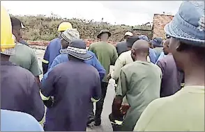  ?? (Courtesy pic) ?? The USA Distillers workers pictured outside the company’s main gate yesterday.