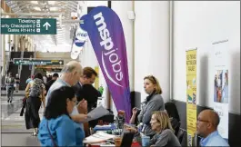  ?? DAVID ZALUBOWSKI / ASSOCIATED PRESS ?? Applicants chat with employers at a July job fair at Minneapoli­s Internatio­nal Airport. On Tuesday, the Labor Department reported that in June, the proportion of workers who quit their jobs hit its highest level in nearly 13 years.