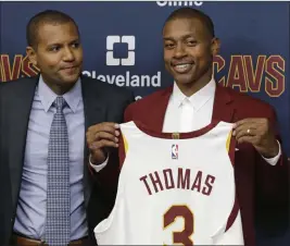  ?? Tony Dejak ?? The Associated Press Isaiah Thomas the newest Cleveland star, and GM Koby Altman on Thursday.