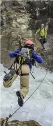  ??  ?? We’re going to cross what? We use ziplines and cable bridges to get past rushing waterfalls.