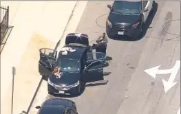  ?? KTLA-TV ?? AN LAPD detective was in a vehicle Tuesday on the 110 in South L.A. when he was fired on. The vehicle was hit, but the officer was unhurt, a spokespers­on said.