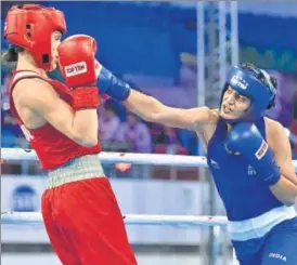  ?? SANJEEV VERMA/HT PHOTO ?? Sonia Chahal (right) lands a punch on Bulgaria’s Stanimira Petrova on Monday.