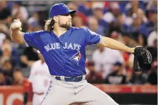  ?? CHRIS CARLSON/ THE ASSOCIATED PRESS ?? Toronto Blue Jays starting pitcher R.A. Dickey pitches against the Los Angeles Angels in Anaheim on Friday. The 41-year-old gave the Jays five innings of shutout baseball.