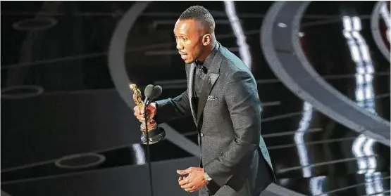  ?? Patrick T. Fallon / New York Times ?? Mahershala Ali accepts the Oscar for best actor in a supporting role for “Moonlight.” The film also won best picture.