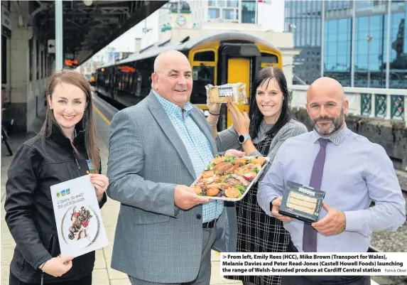  ?? Patrick Olner ?? > From left, Emily Rees (HCC), Mike Brown (Transport for Wales), Melanie Davies and Peter Read-Jones (Castell Howell Foods) launching the range of Welsh-branded produce at Cardiff Central station