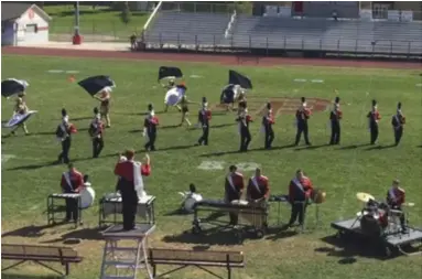  ?? Submitted by Rebecca Mcconnell ?? Senior Drum Major Bobby McConnell leads the SFHS Marching Band in their ballad.