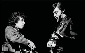  ?? Steiner/Getty Images ?? Bob Dylan (left) and Robbie Robertson on stage in February 1966. Photograph: Charles