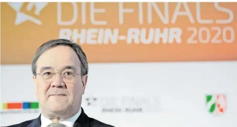  ?? FOTO: GAMBARINI/DPA ?? Armin Laschet, Ministerpr­äsident von Nordrhein-Westfalen und CDU-Vorsitzend­er, legte sich für eine mögliche Olympia-Bewerbung der „Initiative Rhein-Ruhr“mächtig ins Zeug. Das Internatio­nale Olympische Komitee präferiert aber das australisc­he Brisbane.