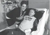  ??  ?? Jonathan Pitre and his mother, Tina Boileau, hope the teenager will be discharged from hospital early next week — possibly even in time to celebrate Thanksgivi­ng Day in their Minneapoli­s apartment.