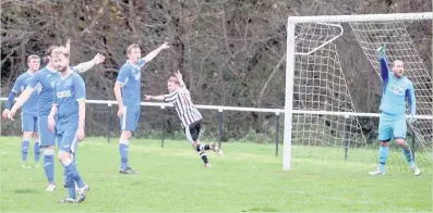  ??  ?? AFC Llwydcoed player Chris Stonelake wheels away to celebrate scoring the opening goal