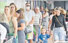  ?? Picture: REUTERS ?? People line up to enter a grocery store before an impending lockdown in Brisbane, Australia on January 8, 2021.