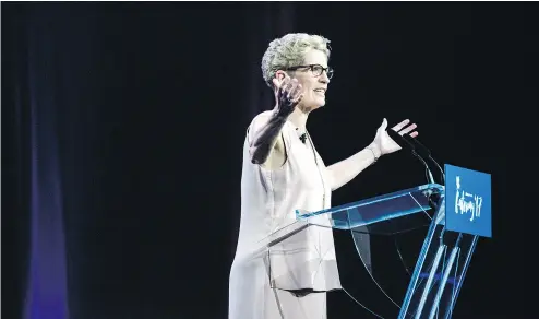  ?? CHRISTOPHE­R KATSAROV / THE CANADIAN PRESS ?? Premier Kathleen Wynne delivers remarks at the Gateway Conference in Toronto on Monday.