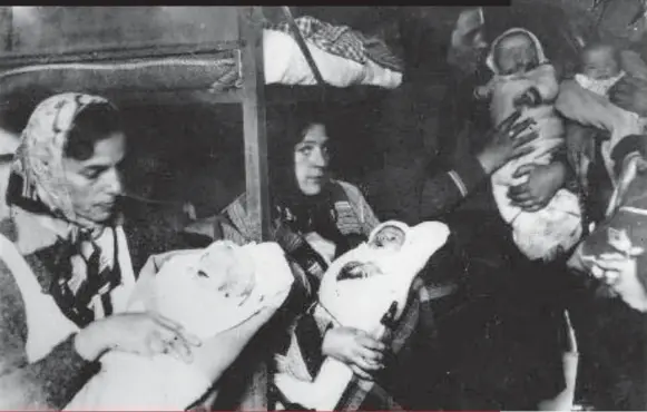  ?? HANKA HOUSKOVA/ BRANDENBUR­G MEMORIAL FOUNDATION ?? Above, Ukrainian and Russian mothers and babies in Ravensbrüc­k
following the camp’s liberation.