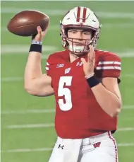  ?? MARK HOFFMAN/MILWAUKEE JOURNAL SENTINEL ?? Wisconsin quarterbac­k Graham Mertz looked unstoppabl­e in the 2020 opener against Illinois, but he struggled at times during the rest of the season.