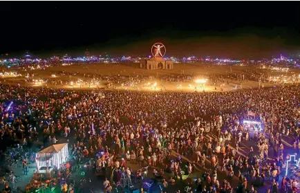  ?? PHOTO: REUTERS ?? Participan­ts fill the Playa as approximat­ely 70,000 people from all over the world gather for the 30th annual Burning Man arts and music festival in the heat and dust of Black Rock Desert of Nevada.
