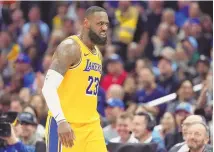  ?? ASSOCIATED PRESS ?? Los Angeles Lakers forward LeBron James scowls after scoring during Wednesday’s game against the Clippers in Los Angeles.