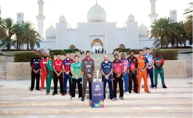 ??  ?? ↑
Captains of the participat­ing teams pose with the trophy prior to the start of the first round of the qualifiers in Abu Dhabi last year.