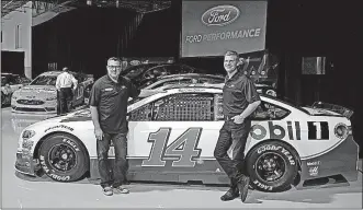  ?? [ASSOCIATED PRESS FILE PHOTO] ?? Team owner Tony Stewart, left, and driver Clint Bowyer pose for a photo during a news conference Jan. 18 in Concord, N.C. Bowyer takes over the No. 14 Ford Fusion for Tony Stewart, who retired after the 2016 season.