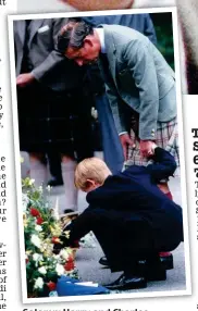  ?? Picture: EMPICS ENTERTAINM­ENT ?? Solemn: Harry and Charles examine tributes at Balmoral